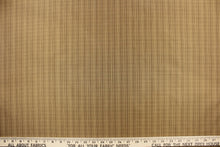 Load image into Gallery viewer, This stunning yarn dyed fabric features a small plaid design in beige and tan.
