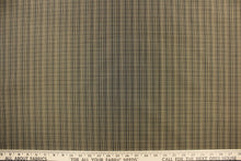 Load image into Gallery viewer, This stunning yarn dyed fabric features a small plaid design in black, and beige.
