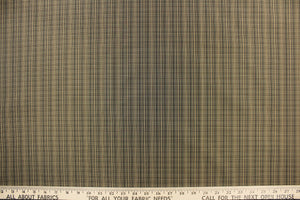 This stunning yarn dyed fabric features a small plaid design in black, and beige.