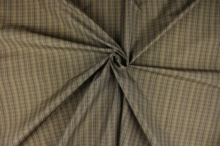 This stunning yarn dyed fabric features a small plaid design in black, and beige.