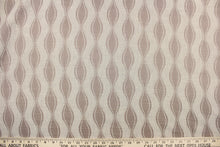 Load image into Gallery viewer, This jacquard fabric features a geometric design in beige and light brown.  
