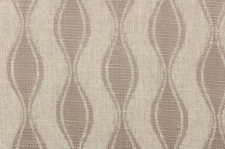 This jacquard fabric features a geometric design in beige and light brown.  