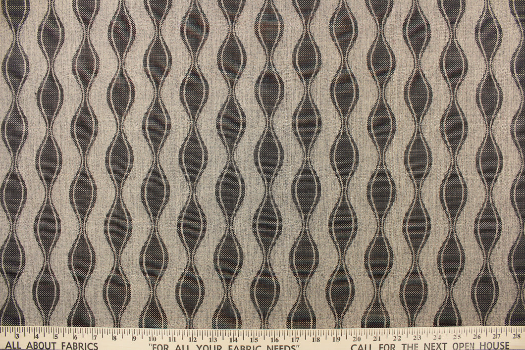  This jacquard fabric features a geometric design in onyx and brown and is perfect for accent pillows, throws, blankets, window treatments (draperies and valances), and upholstery projects.