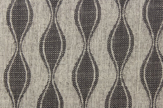 This jacquard fabric features a geometric design in graphite gray and is perfect for accent pillows, throws, blankets, window treatments (draperies and valances), and upholstery projects.