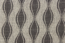 Load image into Gallery viewer, This jacquard fabric features a geometric design in graphite gray and is perfect for accent pillows, throws, blankets, window treatments (draperies and valances), and upholstery projects.
