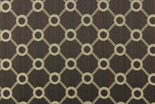 Load image into Gallery viewer,  This jacquard fabric features a geometric design in beige on a brown/black background and is great for home decor such as multi-purpose upholstery, window treatments, pillows, duvet covers, tote bags and more.  It has a soft workable feel yet is stable and durable.
