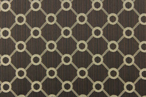  This jacquard fabric features a geometric design in beige on a brown/black background and is great for home decor such as multi-purpose upholstery, window treatments, pillows, duvet covers, tote bags and more.  It has a soft workable feel yet is stable and durable.