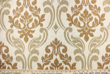 Load image into Gallery viewer, This fabric features a large medallion design in the colors of copper and dull gold on a cream background.  It has a destressed look which enhances the design.  It has a soft drapable hand and would be ideal for swags, window scarves and drapery panels.
