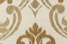 Load image into Gallery viewer, This fabric features a large medallion design in the colors of copper and dull gold on a cream background.  It has a destressed look which enhances the design.  It has a soft drapable hand and would be ideal for swags, window scarves and drapery panels.
