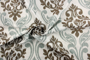 This fabric features a large medallion design in the colors of pistachio, brown and white and has a destressed look which enhances the design.  It has a soft drapable hand and would be ideal for swags, window scarves and drapery panels.