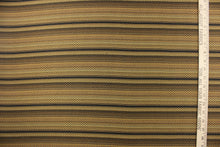 Load image into Gallery viewer,   This jacquard fabric features a heavily striped pattern in shades of black, brown and gold. 
