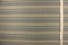 Load image into Gallery viewer, This jacquard fabric features a heavily striped pattern in shades of blue, yellow and gray. 
