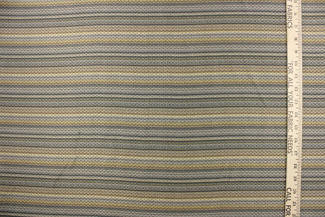 This jacquard fabric features a heavily striped pattern in shades of blue, yellow and gray. 