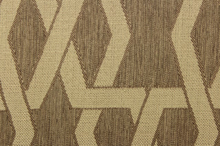 This jacquard fabric features a contemporary pattern with interlocking shapes in light brown against a chocolate brown background.  It can be used for multi purpose upholstery, bedding, accent pillows and drapery.  