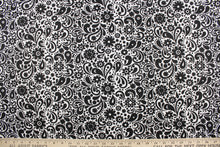 Load image into Gallery viewer,  This cute and soft cotton paisley print bandana with floral accents in black against a white background.
