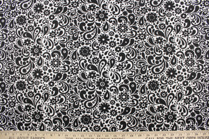  This cute and soft cotton paisley print bandana with floral accents in black against a white background.