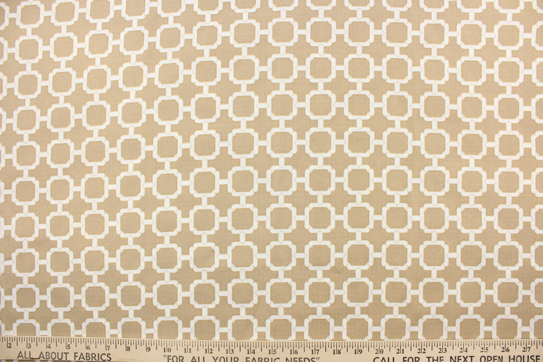 This outdoor fabric features a geometric design in white and beige .