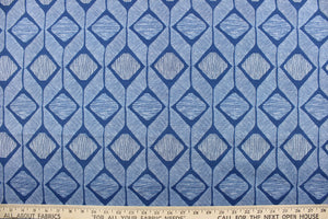 This outdoor fabric features a geometric design in white against a true blue.