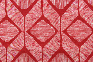 This outdoor fabric features a geometric design in white against a true red.