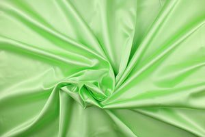  A solid soft green satin.
