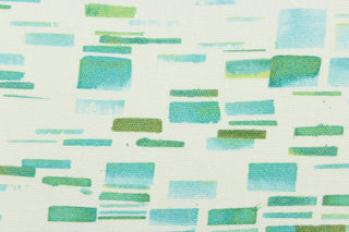 This fabric features a geometric design in beautiful shades of green and blues with white.