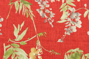 This fabric features a floral design in beige, gray, green, and cream against a red background.