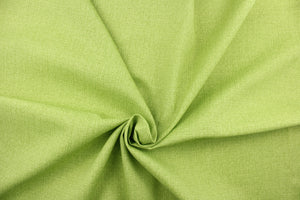 An outdoor fabric in a beautiful solid green with hints of a dark green.
