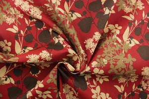 This fabric features a bold floral design in beige, taupe, and brown against a dark red background.