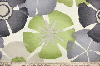 This fabric features a floral design in gray, green, beige, black, and white.