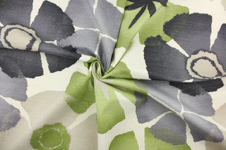 This fabric features a floral design in gray, green, beige, black, and white.