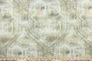 This fabric features a bohemian Aztec design in pale blue, taupe, and white.