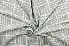 Load image into Gallery viewer, This fabric features a geometric design of thick short stripes in gray against white.
