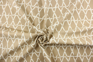 This fabric features a geometric design in white and beige.