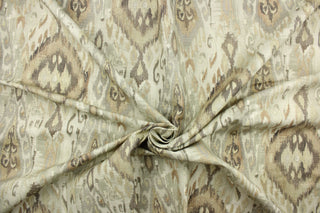 This fabric features a Aztec or tribal  like design in beige, gray, golden tan, and off white.