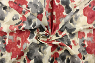 This fabric features a watercolor floral design in gray, light beige, rich red, and dull white.