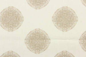 This fabric features a circle design in beige against a dull white. 