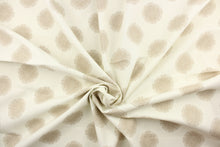 Load image into Gallery viewer, This fabric features a circle design in beige against a dull white. 

