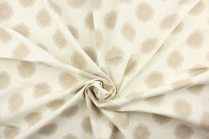 This fabric features a circle design in beige against a dull white. 