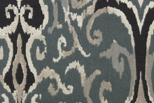 Load image into Gallery viewer,  This beautiful fabric features a enteric ikat design in gray, black , taupe, off white and blue gray. 
