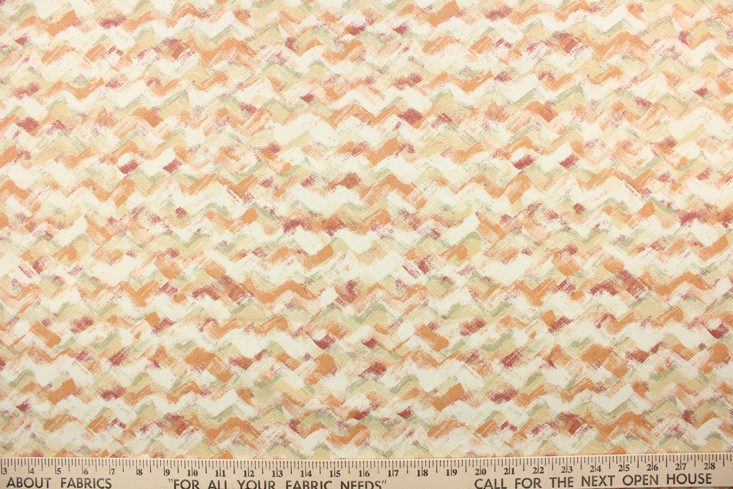 This fabric features a chevron design in orange, brick red, gray green, light beige, and dull white. 