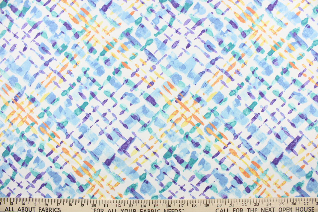 This outdoor fabric features a diagonal plaid design in purple, blue , yellow, orange, and turquoise against a white background.