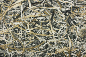 This camo fabric in tan, beige, black, gray, and taupe.