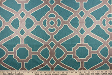 Load image into Gallery viewer, This fabric features a geometric design in dark bronze outline in off white against a teal background. 
