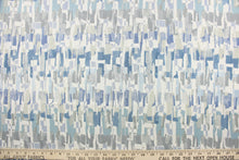 Load image into Gallery viewer, This fabric features an abstract design in shades of blue, gray and white.
