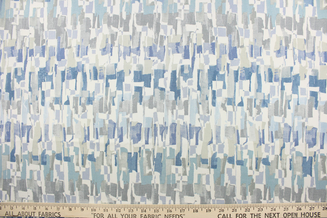This fabric features an abstract design in shades of blue, gray and white.