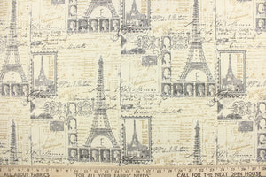 This fabric features a Paris theme design in gray, black, off white and beige. 