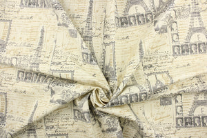 This fabric features a Paris theme design in gray, black, off white and beige. 