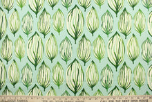 Load image into Gallery viewer, This fabric features a tropical leaf design in green and dull white against a light blue background. 
