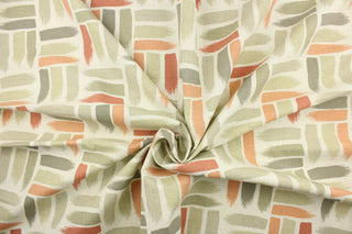 This fabric features a geometric design of horizontal and vertical short brush strokes in shades of clay, peach, gray, and light taupe on a natural or off white background