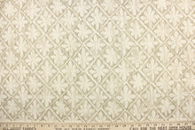 Load image into Gallery viewer, This fabric features a flower tile design in dull white and gray. 
